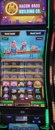 Bacon Bros Building Co. game title above its pig-themed reel display