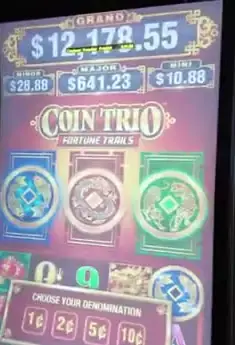 Coin Trio Fortune Trails title on Celebrity Xcel cabinet
