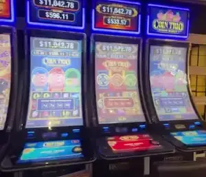 Coin Trio title and game screens on Celebrity Reflection slot cabinets