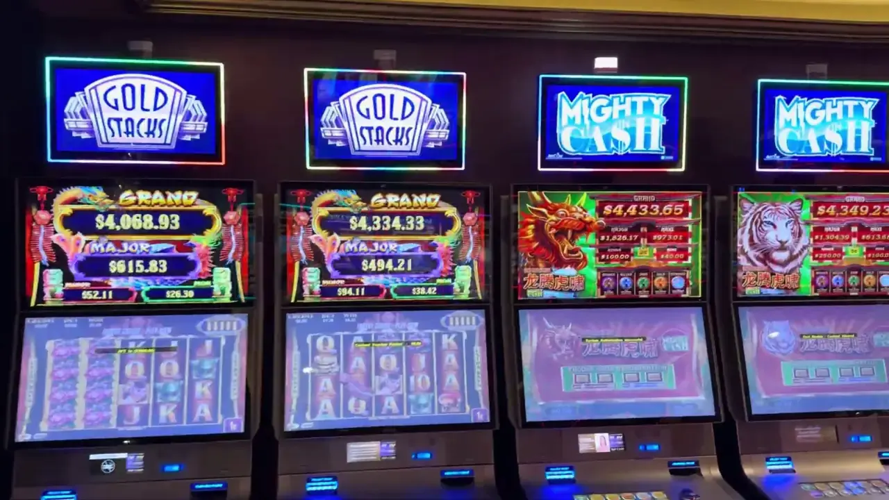 Anthem of the Seas casino video frame showing Gold Stacks, Mighty Cash.