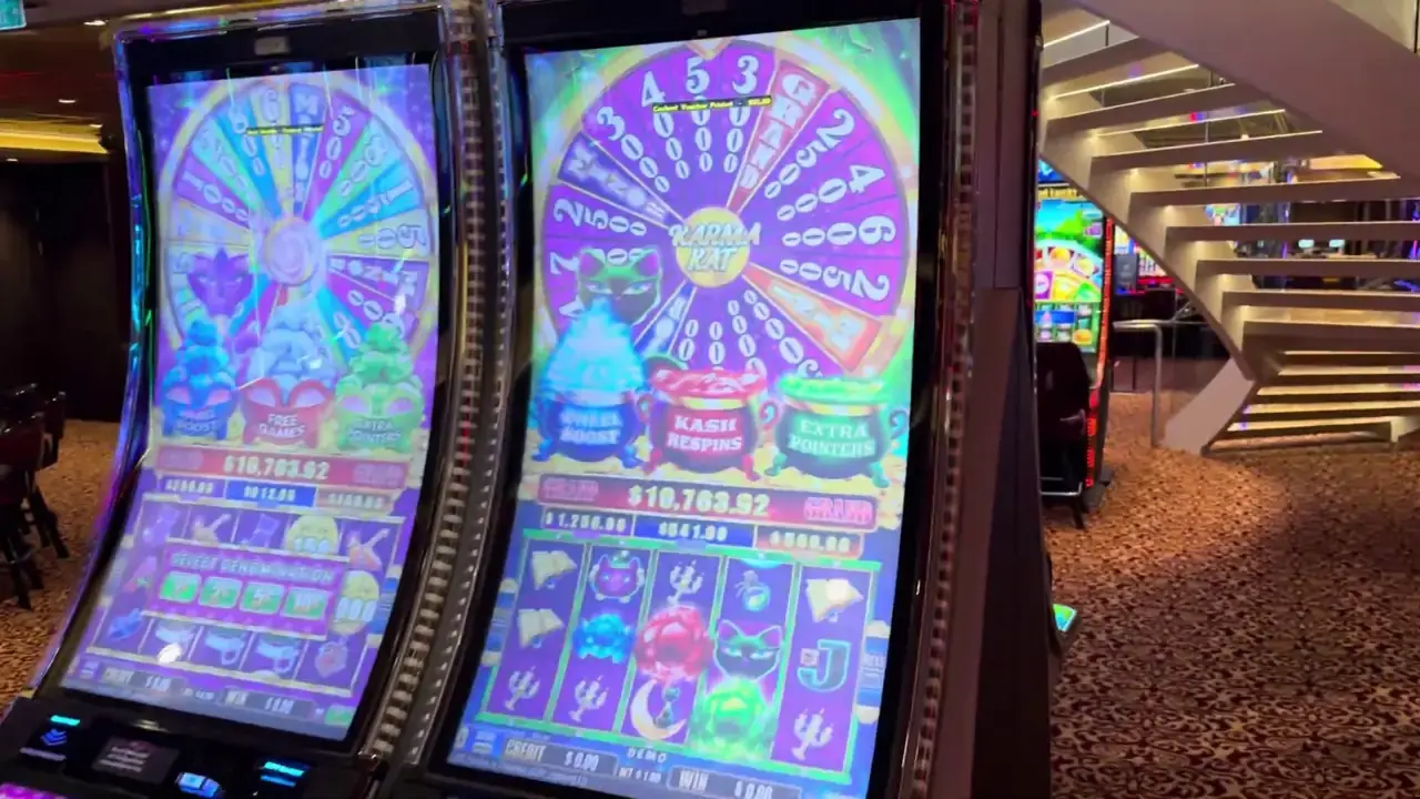 Anthem of the Seas casino video frame showing Karma Kat.