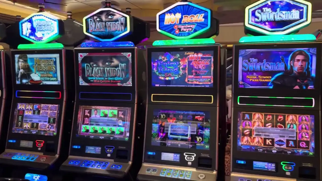 Anthem of the Seas casino video frame showing Midnight Treasures, Black Widow, Hot Roll: Fantasy Pays, The Swordsman.