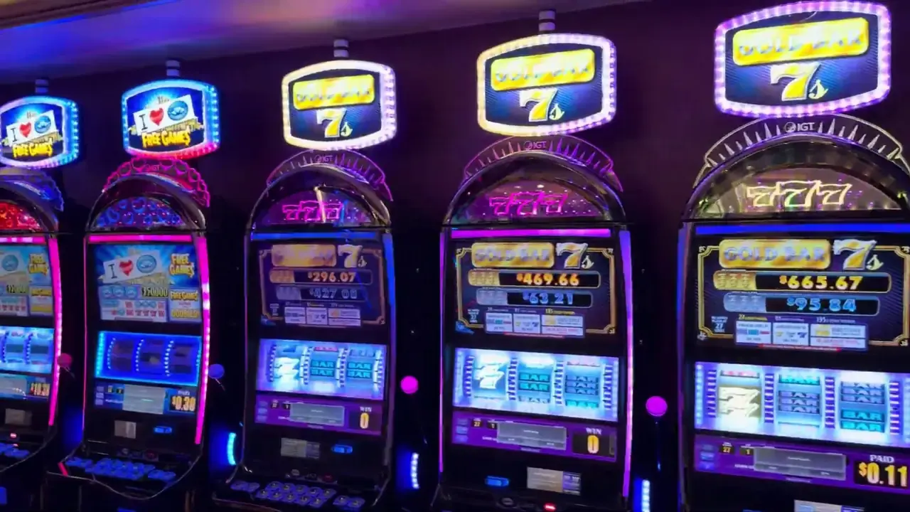 Anthem of the Seas casino video frame showing Gold Bar 7s and a nearby partially readable Free Games topper.