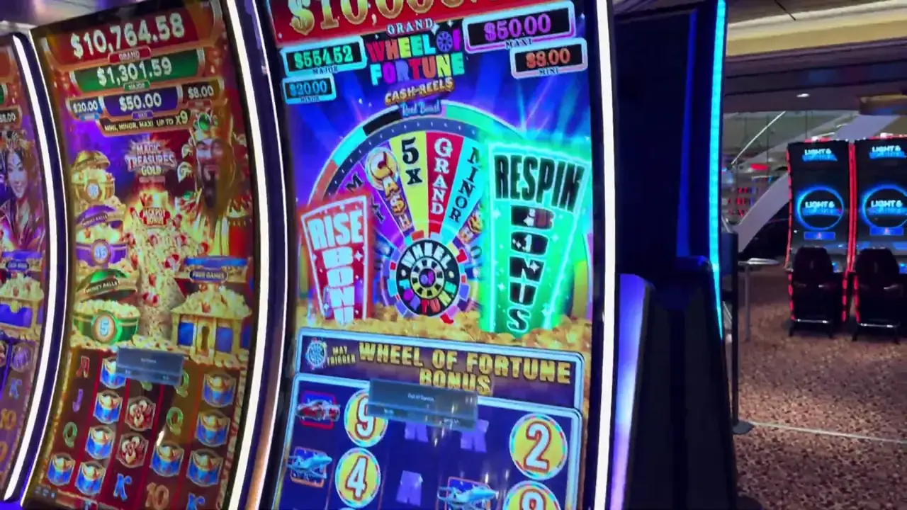 Anthem of the Seas casino video frame showing Wheel of Fortune: Cash Reels.