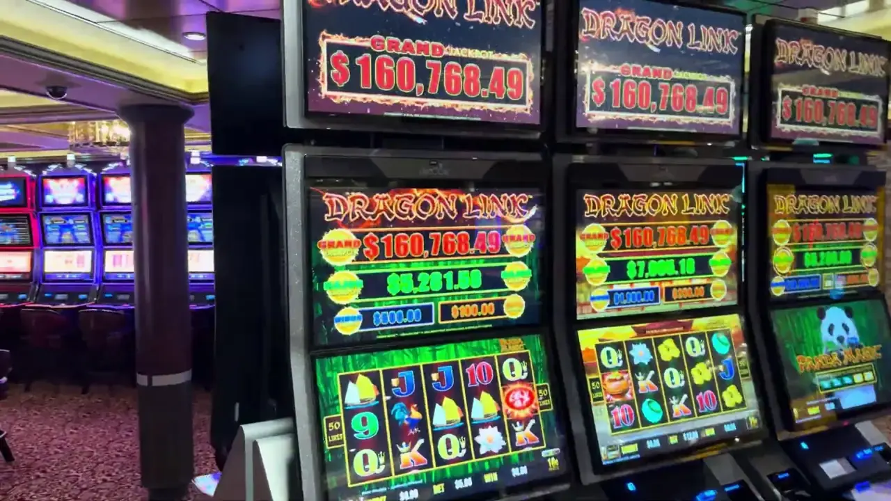 Anthem of the Seas casino video frame showing Dragon Link: Panda Magic, Dragon Link: Happy & Prosperous.