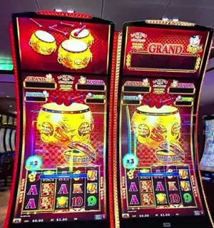 Dancing Drums Golden cabinet and game artwork aboard Celebrity Xcel