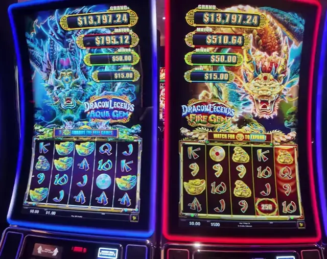 Dragon Legends Aqua Gem and Fire Gem visible on illuminated cabinets aboard Wonder of the Seas.
