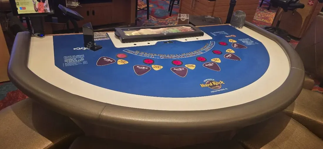 Empty blackjack table with 6 to 5 payout printed on the felt at Seminole Hard Rock Hollywood