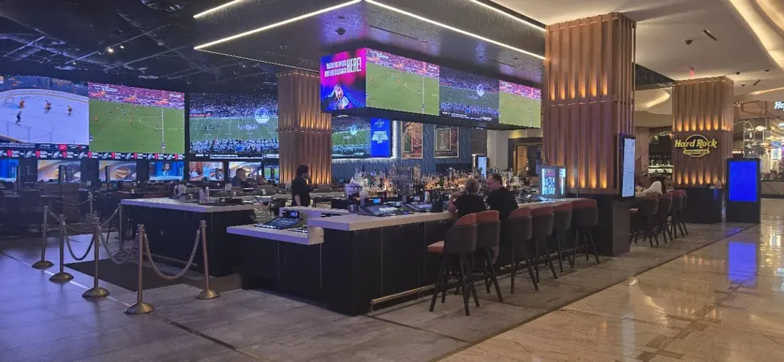 Sportsbook bar with large television screens at Seminole Hard Rock Hollywood