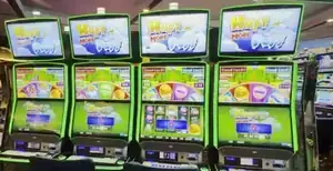 Huff N' More Puff titles above the slot cabinets in the Celebrity Apex casino