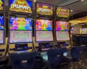 Mo' Mummy titles on a bank of Celebrity Apex slot cabinets
