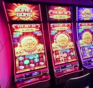 Money Gong titles visible above Celebrity Edge slot cabinets