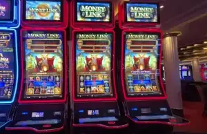 Money Link titles above Celebrity Reflection slot cabinets