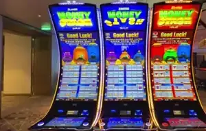Money Link titles visible above three Celebrity Xcel slot cabinets