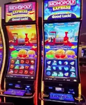 Monopoly Express titles above Celebrity Reflection slot cabinets