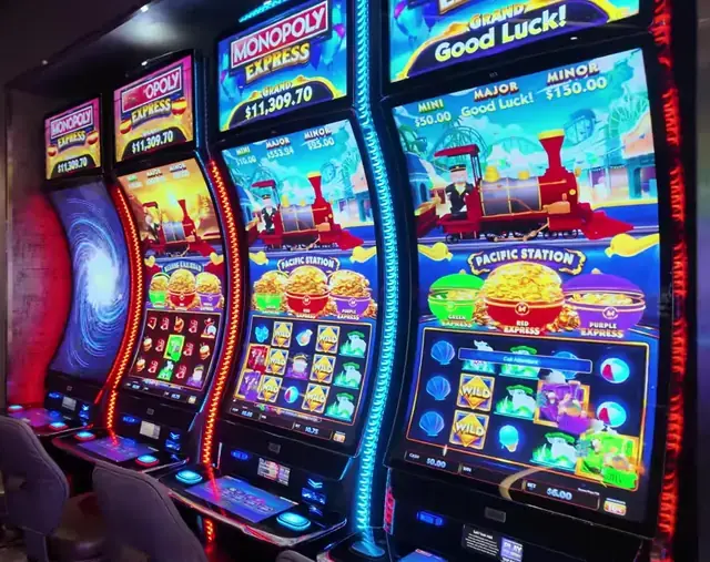 Monopoly Express bank, including Pacific Station and Beijing Railroad visible on illuminated cabinets aboard Wonder of the Seas.