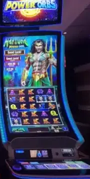 Power Orbs title above a Celebrity Reflection slot cabinet