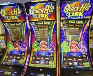Quick Hit Link titles above three Celebrity Apex slot cabinets