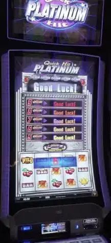 Quick Hit Platinum title and reel screen on a casino cabinet