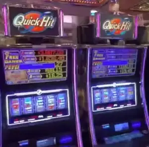 Quick Hit titles above Celebrity Infinity slot cabinets