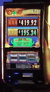 Red Hot Tamales title and reels on a slot cabinet
