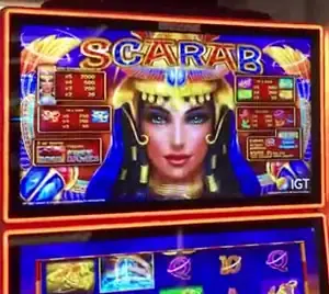 Scarab title and game screen on a Celebrity Millennium slot cabinet