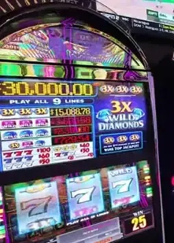 3x Wild Diamonds title and reels on a Celebrity Beyond casino cabinet