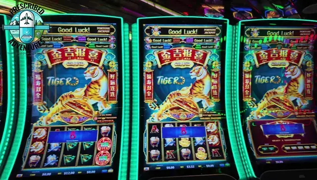 Slot cabinets showing Jin Ji Bao Xi Grand: Tiger aboard Enchantment of the Seas.