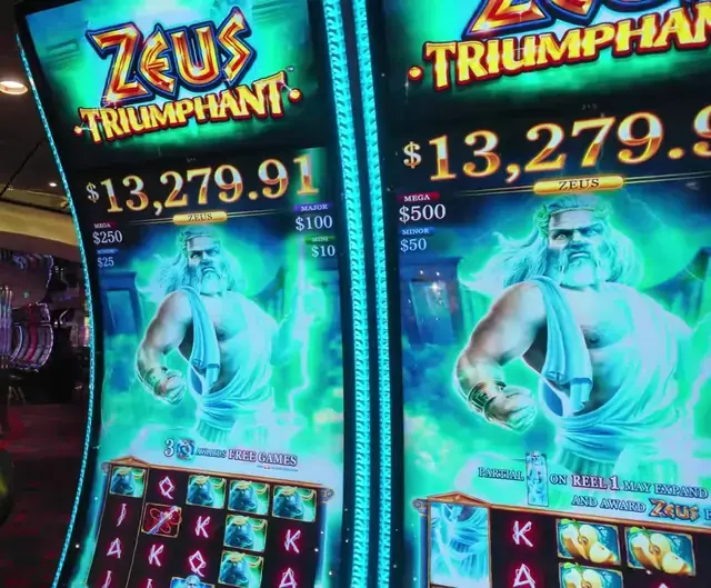 Slot cabinets showing Zeus Triumphant aboard Oasis of the Seas.