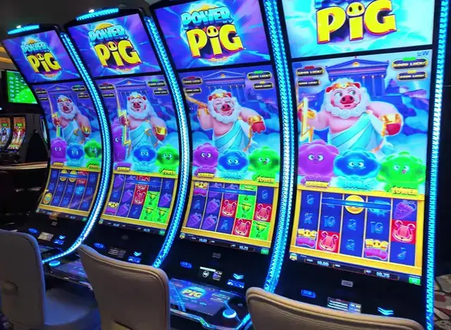 Slot cabinets showing Power Pig aboard Legend of the Seas.