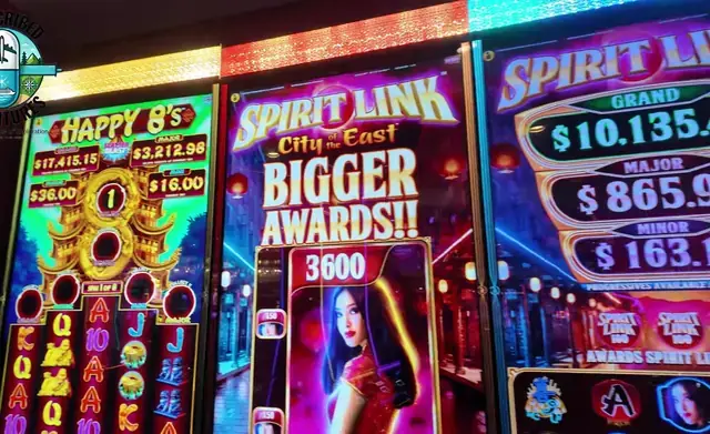 Slot cabinets showing Happy 8’s, Spirit Link: City of the East aboard Oasis of the Seas.