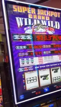 Wild Wild Gems title and reels on a Celebrity Beyond slot cabinet