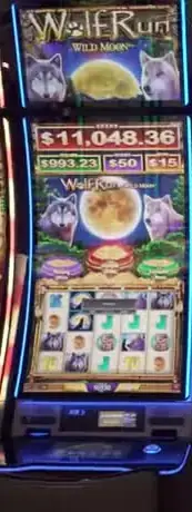 Wolf Run Wild Moon title and symbols on a casino slot cabinet